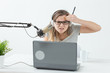 © satura_ - Blogger, streamer and people concept - Funny young woman DJ working on the radio