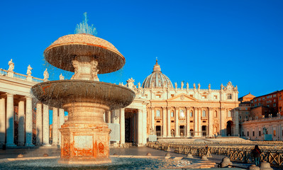 Wall Mural - St. Peter's Basilica in Rome. Fountain of St. Peter's Square by Gian Lorenzo Bernini. Rome architecture and landmark. Italian Renaissance church.