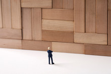 Giant Wall And Miniature Businessman