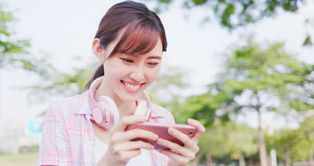 Wall Mural - girl play game on phone