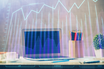 Financial market graph hologram and personal computer on background. Double exposure. Concept of forex.