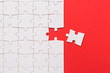 Business teamwork concept, Missing puzzle piece on red background. Search for the solution, solve the problem....