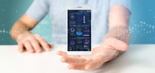 Poster - Businessman holding Smartphone with user interface data on the screen isolated on a background