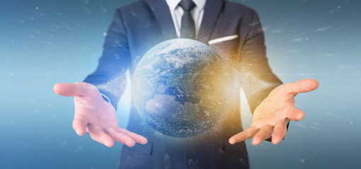 Poster - businessman holding a 3d rendering particles earth globe