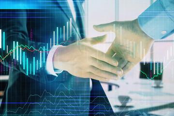 Multi exposure of financial graph on office background with two businessmen handshake. Concept of success in business