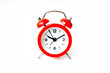 close up of a vintage red bell clock on white background