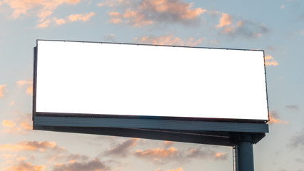 mock up image: wide blank white billboard or large display and clouds against sunset warm sky. consu