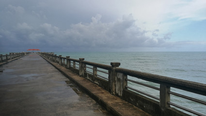  Pier with sea, sky and cloud at Natai beach, Phang-nga provience, Thailand. Quite, peaceful and beautiful place.