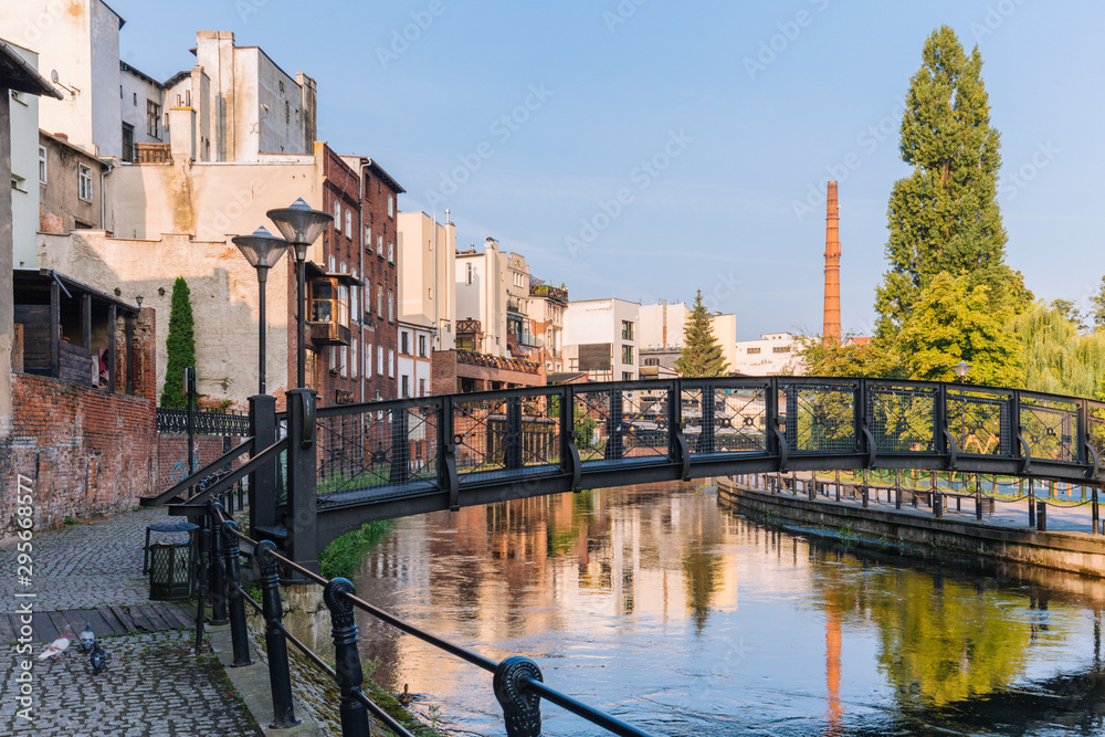 Bydgoszcz. View of the architecture and small bridge on the Brda river - obrazy, fototapety, plakaty 