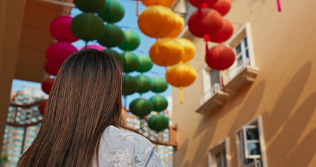 Poster - Woman look at the chinese lantern hanging at outdoor