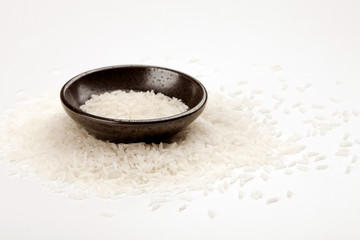 Wall Mural - white rice in a plate on a white table