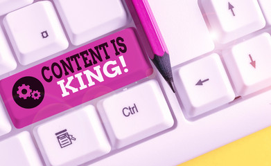 Conceptual hand writing showing Content Is King. Concept meaning marketing focused growing visibility non paid search results White pc keyboard with note paper above the white background