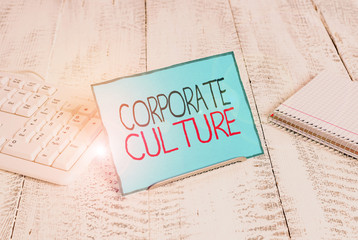 Poster - Writing note showing Corporate Culture. Business concept for pervasive values and attitudes that characterize a company Notepaper on wire in between computer keyboard and sheets