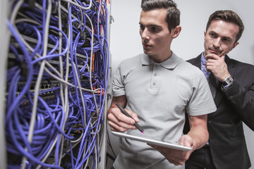 Engeneers in network server room