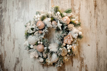 Christmas Artificial Wreath With White And Rosa Color Toys, Balls, Tapes And Flowers