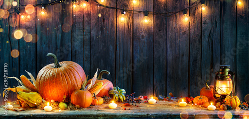 Thanksgiving - Pumpkins On Rustic Table With Candles And String Lights Tableau sur Toile