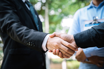  Business people shaking hands, finishing up a meeting