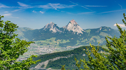 Wall Mural - Switzerland, Panoramic view on green Alps and Mythens mountains.