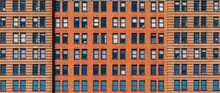 Banner And Cover Scene Of Brown Brick High Building Facade With Windows In New York City, United States Of America, USA, Industrial Background And Texture, Loft Inspiration. Construction Facade,
