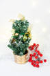 Little christmas tree with decoration, golden Christmes ornaments