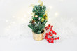 Christmas tree with  golden decorations on white background