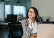 © mavoimages - Businesswoman thinking about work while sitting at her office desk