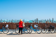 Rental Bikes On The Beach. Blue Bicycles On The Street.