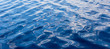 Leinwanddruck Bild - blue water with waves surface background