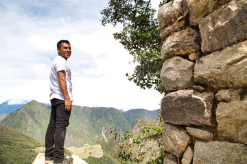 Traveller at the Lost city of the Incas, Machu Picchu,Peru on top of the mountain, with the view panoramic