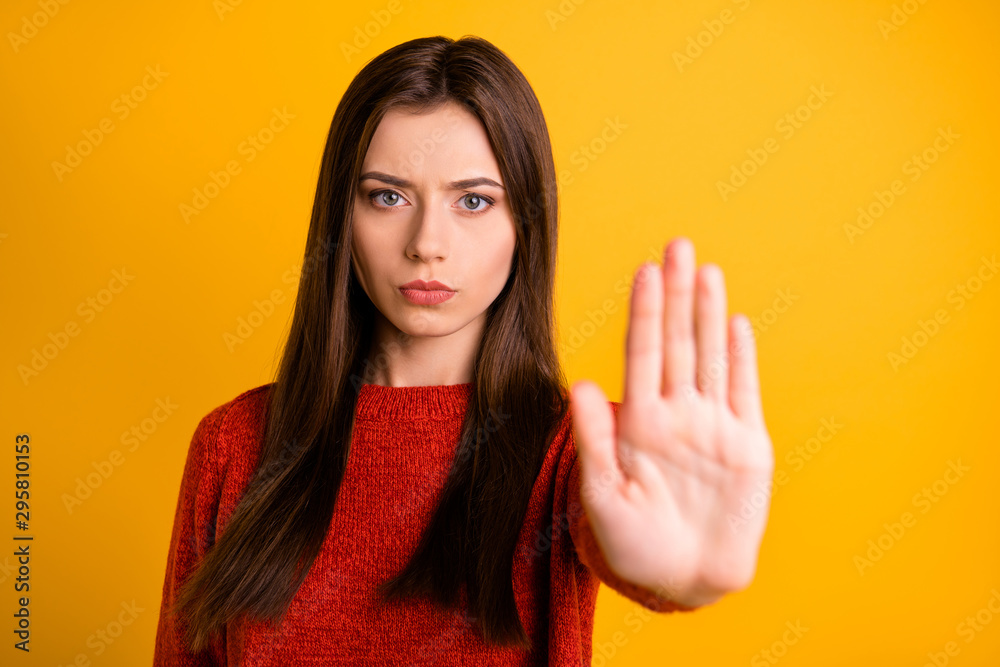 Photo of cute serious confident woman showing you her hand palm for you to stop movement isolated over yellow vivid color background - obrazy, fototapety, plakaty 