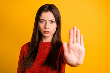 photo of cute serious confident woman showing you her hand palm for you to stop movement isolated ov