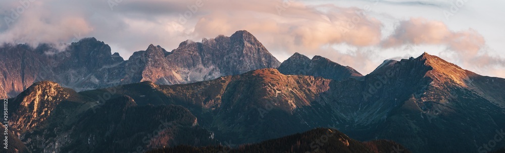 Mountain peaks at sunset. Tatra Mountains in Poland. - obrazy, fototapety, plakaty 