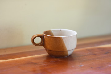 cup of coffee on wooden table