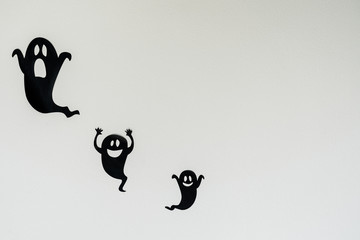 Fototapete - Table top view aerial image of decoration Happy Halloween day background concept.Flat lay accessories essential object to party the black ghost on rustic white stone.Space for creative design text.