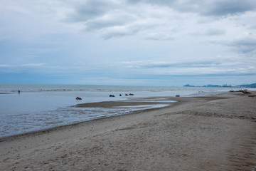 Blue beach with low water