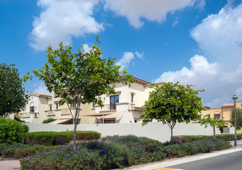 Wall Mural - Luxury villa compound housing development with beautiful blue sky with white clouds