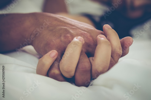Fotomural Passionate couple in love having sex on the bed at home