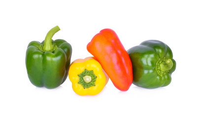 Wall Mural - Sweet peppers green yellow red on white background