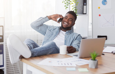 Poster - Joyful black manager talking on phone while having break at work