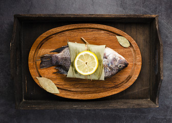 Wall Mural - Top view delicious fish with lemon on plate