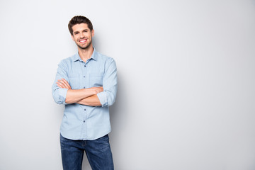 Poster - Portrait of positive cheerful cool college university man cross hand feel like true leader person wear denim jeans style outfit isolated over grey color background