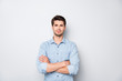 © deagreez - Real freelancer concept. Portrait of serious focused guy feel masculine true professional expert cross his hands wear denim jeans style clothes isolated over grey color background