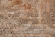 © kopikoo - Old and weathered large stone blocks wall texture. Beige sandstone tones