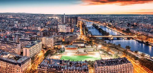 Wall Mural - Paris city skyline rooftop view with River Seine at night, France. Evening panorama.