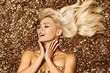 © ASjack - Beautiful blonde woman in golden flowers garden