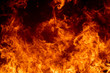 © Torychemistry - Close up hot fire flame burning glowing on black dark background, fire flame on full flame photo, beautiful abstract fire wallpaper or graphic background, panorama view of blaze glowing flame