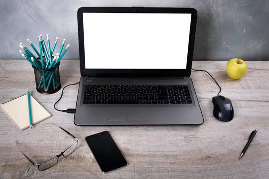 Workspaces mock up Laptop on wood table with glass phone smartphone pencil apple notebook mouse desk with copy space for graphics or products display montage.Working place of designer,close-up Office.