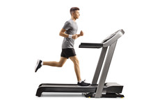 Young Guy Running On A Professional Treadmill