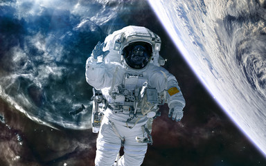 deep cosmic landscape. astronaut, planet against background of nebulae. science fiction. elements of