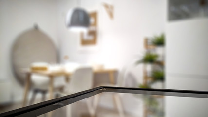 Wall Mural - glass table top with blurred luxury home interior. table background with empty space for products an